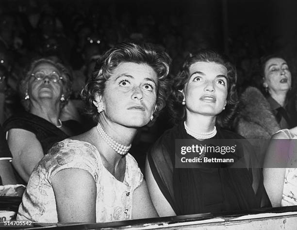 Chicago, IL: Mrs. John F. Kennedy and Mrs. Sargent Shriver, Sister of Sen. Kennedy , Watch the keynote campaign film being shown during the evening...
