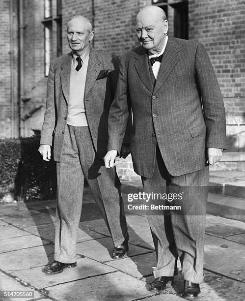 Westerham, England: Sir Winston Churchill guides Field Marshal Viscount Montgomery around his Charwell country home Nov. 29th, on the eve of his 83rd...