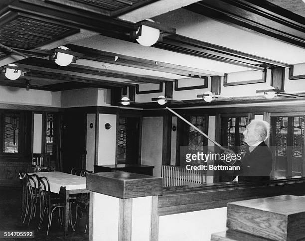 Chicago, Illinois: Renowned architect Frank Lloyd Wright points out features of "Robie House" here March 18th, after arriving to try and save the...