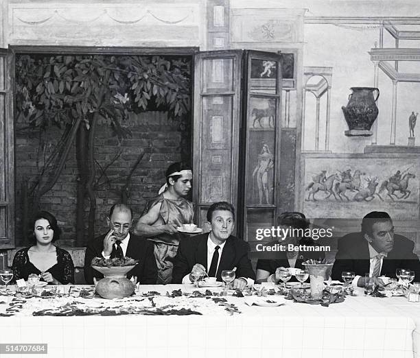 Ostia Antica, Italy: Film star Kirk Douglas is host at a farewell party for the members of the cast and crew of the motion picture "Ulysses," in...