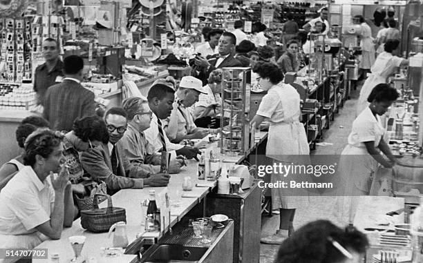 Dr. John O. Brown led a racially-mixed group to a segregated lunch counter in Grant's Department Store in Miami, said he will ask the store managers...