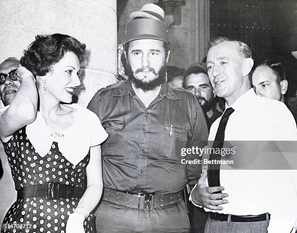 Havana, Cuba: Cuban Premier Fidel Castro is pictured with screen stars Maureen O'Hara and Alec Guinness at Havana's Cathedral Square, May 13, during...