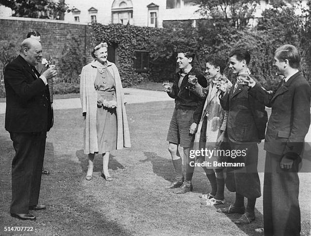 England: Prime Minister Winston Churchill drinks a toast to "Free France" with the five French youths who arrived on the South Coast recently after...