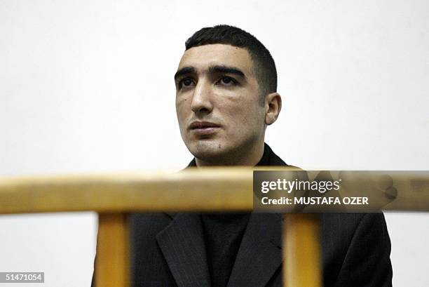 Turkish Ali Umit Demir sits in Beyoglu courthouse in Istanbul, charged with killing Leeds fans Christopher Loftus and Kevin Speight in April 2000...