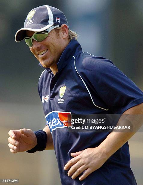 Australian cricketer Shane Warne runs before a practice session of the Australian cricket team in Madras 12 October 2004. The second five-day Test...