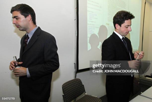 Google co-founders Larry Page and Sergey Brin part after addressing a ...