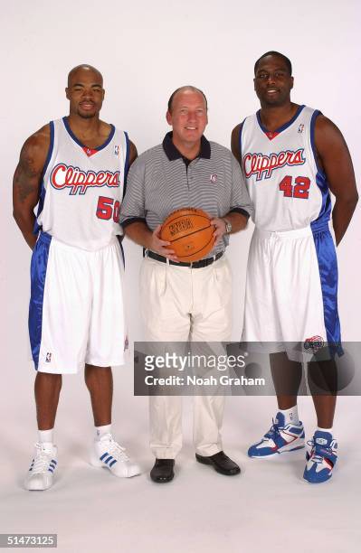 Corey Maggette, coach Mike Dunleavy Sr. And Elton Brand of the Los Angeles Clippers pose for a portrait during NBA Media Day on October 4, 2004 in...