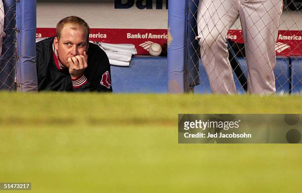 Pitcher Curt Schilling of the Boston Red Sox sits dejected in the dugout in the forth inning during game one of the American League Championship...