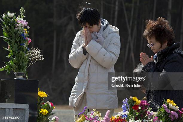 People offer prayers at Okawa Elementary School on March 11, 2016 in Ishinomaki, Japan. Today marks the fifth anniversary of the magnitude 9.0...