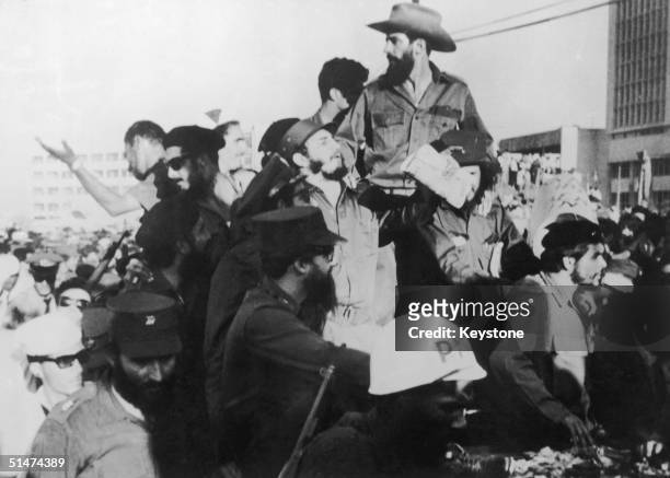 Cuban President Fidel Castro, centre, arriving in Havana, Cuba, with Che Geuvara, right, and Major Camilo Cienfeugos, top, 1st December 1959.