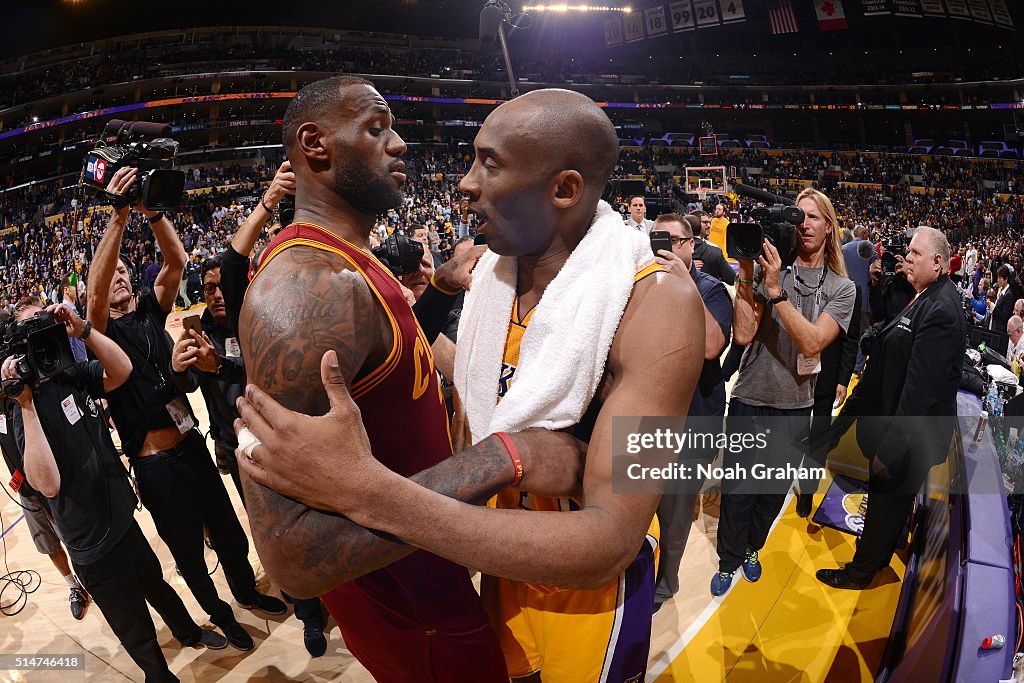 Hug Jim Kobe Bryant of the Los Angeles Lakers shares a hug with LeBron James ...
