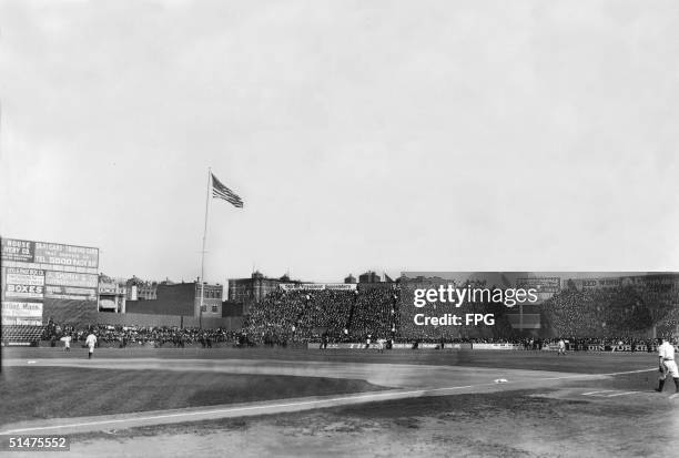 General view of Boston's Fenway Park, home of the American League baseball team the Boston Red Sox, shows stands full of fans, early 20th Century.