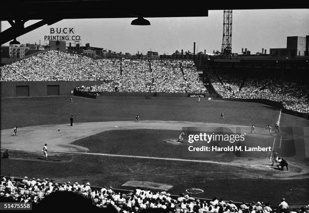 General view of a baseball game in progress at Boston's Fenway Park, home of the American League baseball team the Boston Red Sox, 1950s.