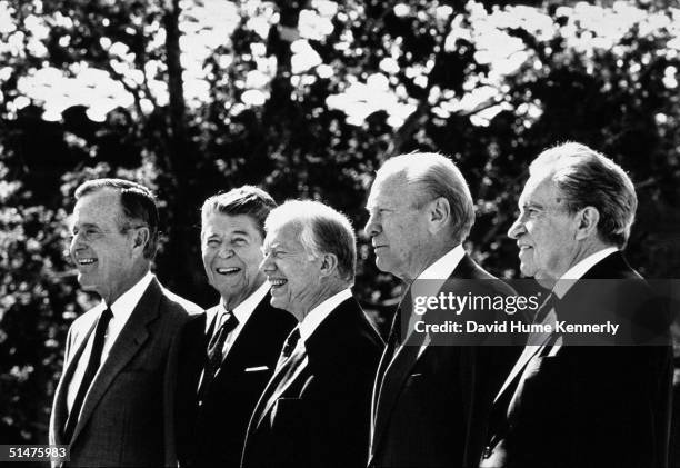 Former Presidents George H.W. Bush, Ronald Reagan, Jimmy Carter, Gerald Ford and Richard Nixon pose during the Ronald Reagan Library dedication...