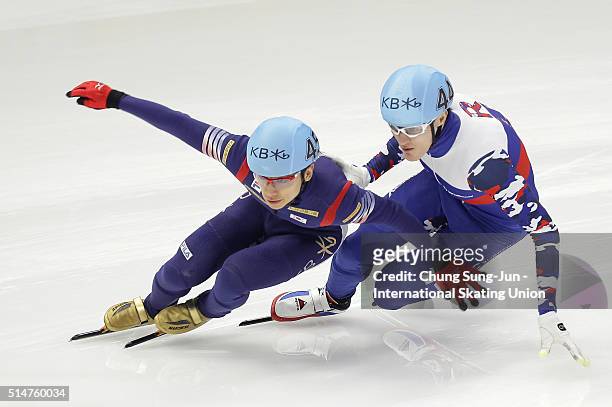 Kwak Yoon-Gy of South Korea and Vladimir Grigorev of Russia compete in the Men 1000m-Heats during the ISU World Short Track Speed Skating...