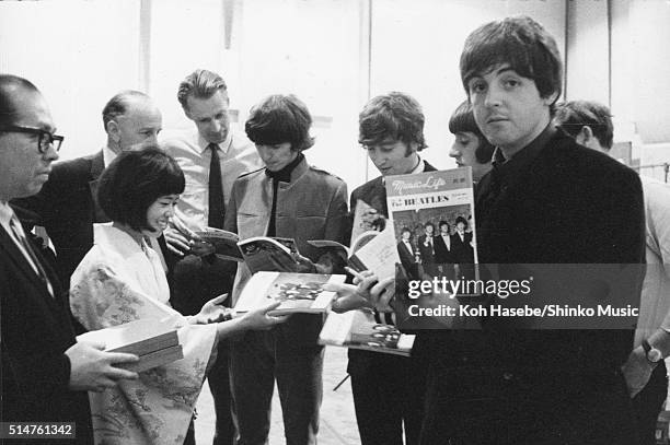 The Beatles at EMI Studios, Abbey Road, London during the recording session for 'It's Only Love', June 15, 1965. Left to right: Joe Miyasaki, Rumi...