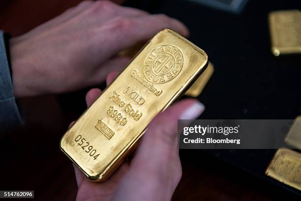 An Argor-Heraeus SA stamp sits on a one kilogram gold bar in this arranged photograph taken at Solar Capital Gold Zrt. In Budapest, Hungary, on...
