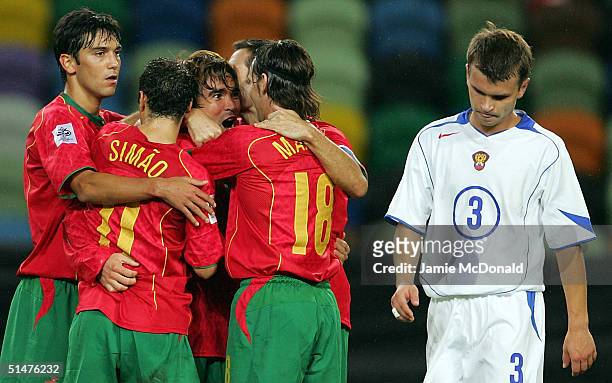 Deco of Portugal celebrates his goal with team mates during the World Cup Group 3 match between Portugal and Russia on October 13, 2004 at the...