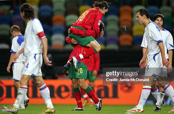 Deco of Portugal celebrates his goal with Maniche during the World Cup Group 3 match between Portugal and Russia on October 13, 2004 at the Estadio...