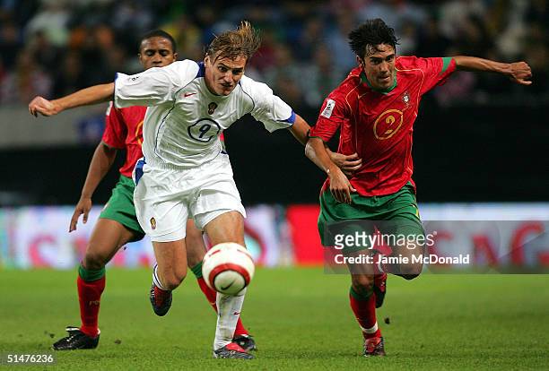 Dmitry Bulykin of Russia battles with Paulo Ferreira of Portugal during the World Cup Group 3 match between Portugal and Russia on October 13, 2004...