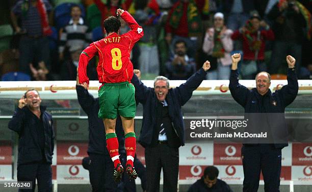 Petit of Portugal celebrates his goal during the World Cup Group 3 match between Portugal and Russia on October 13, 2004 at the Estadio Jose...