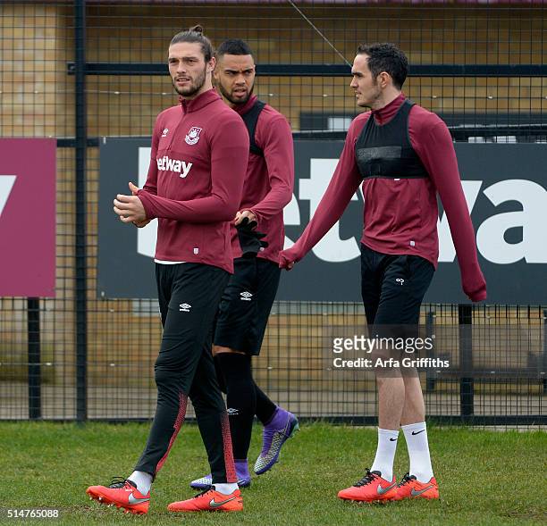 Andy Carroll with Winston Reid and Joey O'Brien of West Ham United during Training at Chadwell Heath on March 11, 2016 in London, England.