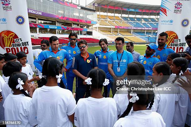 Mohammad Nabi, Shapoor Zadran, Asghar Stanikzai, Mohammad Shahzad and Dawlat Zadran of Afghanistan talk to local kids during the ICC Cricket For Good...