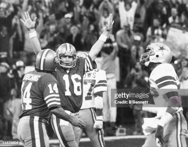 Quarterback Joe Montana of the San Francisco 49ers celebrates after 49ers kicker Ray Wersching kicks the winning extra point to defeat the Dallas...