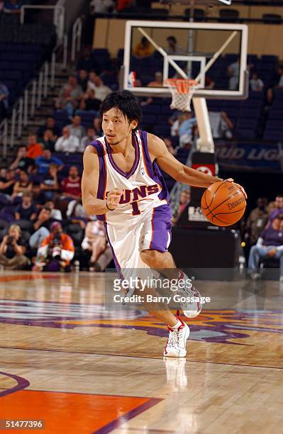 Yuta Tabuse of the Phoenix Suns drives against the Los Angeles Clippers on October 13, 2004 at America West Arena in Phoenix, Arizona. NOTE TO USER:...