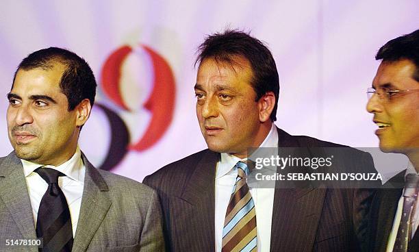 Indian actor Sanjay Dutt answer queries from journalists at the launch of his company 'S.O.N' as he stands alongside Percept P9 Integrated Chief...