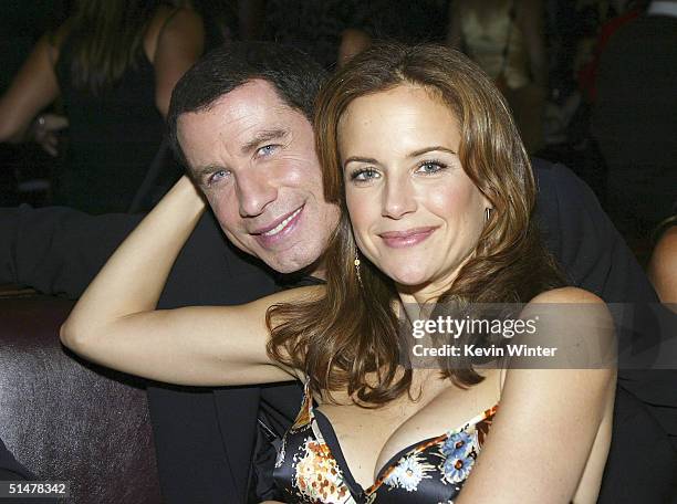 Actors John Travolta and his wife Kelly Preston pose at the after party for the premiere of Lions Gates' "Eulogy" at the Palomino Restaurant on...