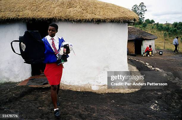 Nobule Ngema gathers her traditional clothing as she prepares to travel to the annual Reed Dance on September 10, 2004 in Ngudwini village in rural...