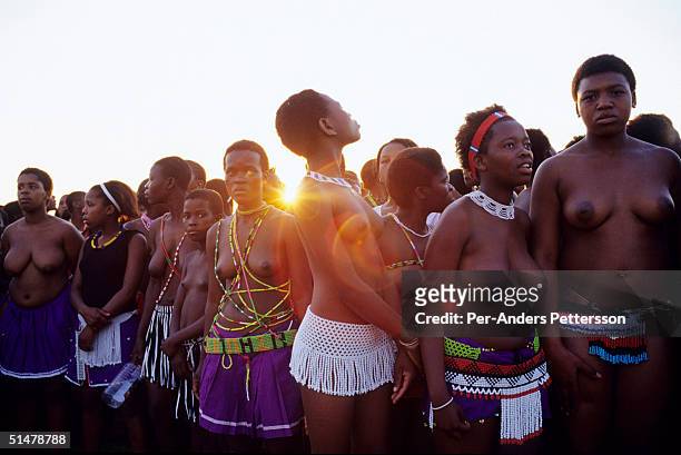 Maidens wait to perform at the Royal Palace as the suns sets during the annual Reed Dance on September 11, 2004 in Nongoma in rural Natal, South...
