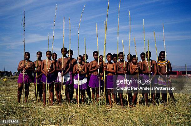 Maidens stand with their reeds before going to the Royal Palace during the annual Reed Dance on September 11, 2004 in Nongoma in rural Natal, South...