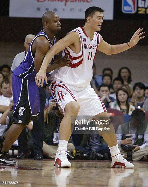 Yao Ming of the Houston Rockets goes up against Alton Ford of the Sacramento Kingsat the pre-season NBA China game between the Sacramento Kings and...