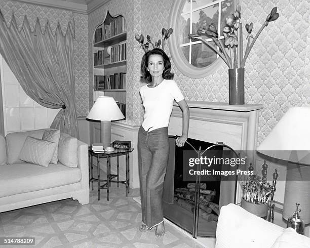 Lee Radziwill photographed in the living room that she personally decorated circa 1976 in New York City.
