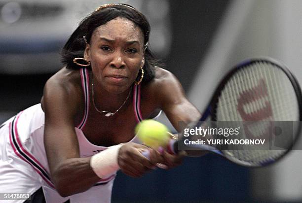 Venus Williams hits the ball to Russian Vera Douchevina during their match at the WTA Kremlin Cup tennis tournament in Moscow, 14 October 2004....