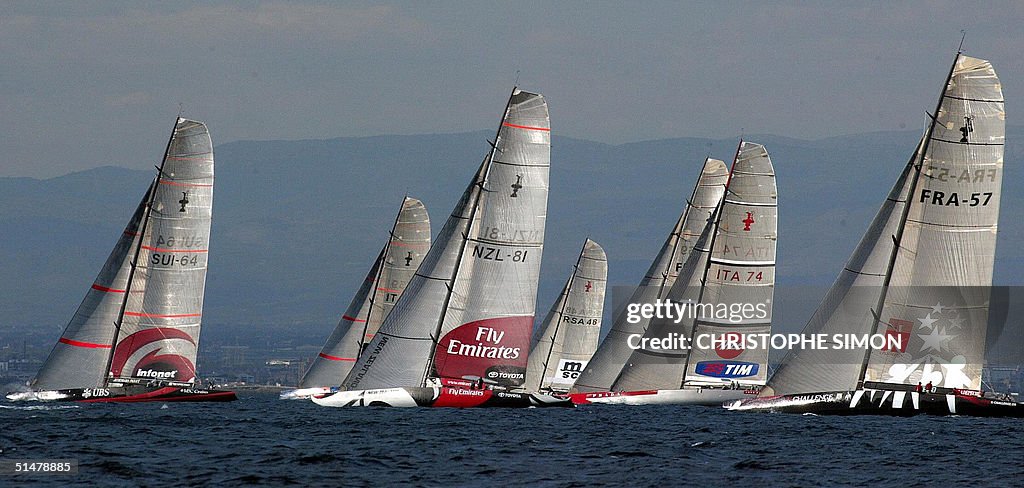 Swiss Team Alinghi (L) leads the fleet r