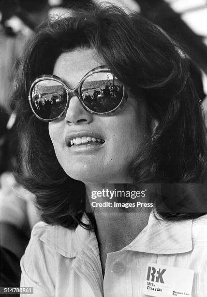 Jacqueline Kennedy Onassis in huge sunglasses attends the Robert F. Kennedy Pro Celebrity Tennis Tournament at Forest Hills Stadium circa August 1975...