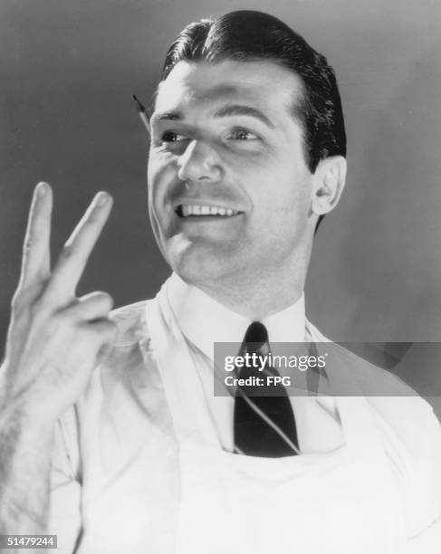 Shop assistant verifies the customer's order with a v-sign, circa 1947.