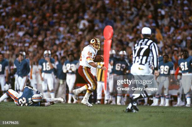 Running back John Riggins of the Washington Redskins rushes for yards during Super Bowl XVII against the Miami Dolphins at the Rose Bowl on January...