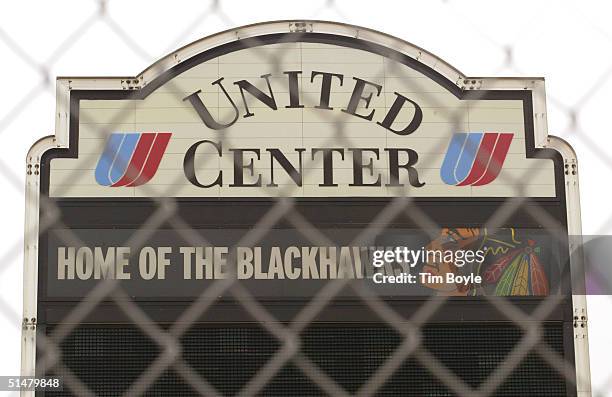 Venue signage is visible through a security fence at the United Center, home of the NHL Chicago Blackhawks hockey team, October 14, 2004 in Chicago,...