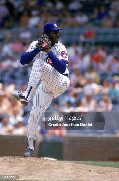 Lee Smith of the Chicago Cubs winds back to pitch during a June, 1987 season game at Wrigley Field in Chicago, Illinois.