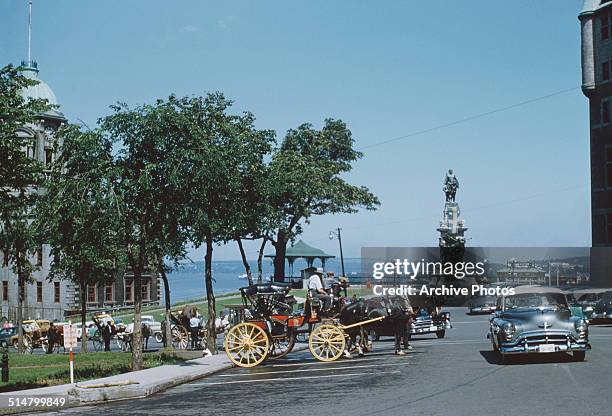 The statue of Samuel de Champlain on the Terrasse Dufferin seen from the Rue du Fort in Quebec City, Quebec, Canada, with the Château Frontenac on...