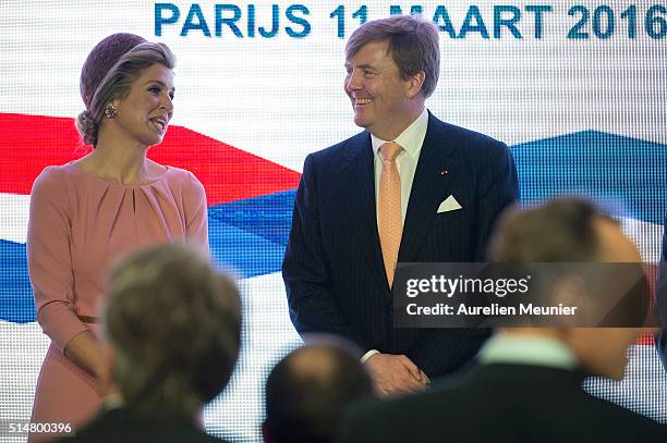 King Willem-Alexander of The Netherlands and Queen Maxima pose on stage after a contract signing between Dutch and French businesses during an...