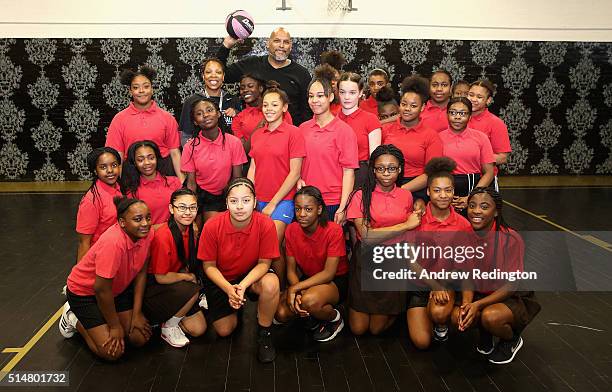 Local schoolgirls are pictured with coach Lisa Williams and former NBA player John Amaechi during the launch of the Fight 4 Change female only...