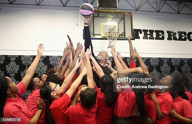 Local schoolgirls are pictured with former NBA player John Amaechi during the launch of the Fight 4 Change female only "Contenders" initiative on...