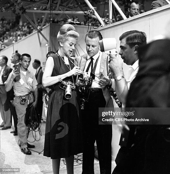 News reports from the 1960 Democratic National Convention, Los Angeles, California CBS News correspondent, Betty Furness, gets some technical advice...