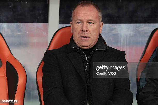 Mano Menezes, head coach of Shandong Luneng, looks on during the Chinese Football Association Super League match between Shandong Luneng and Liaoning...