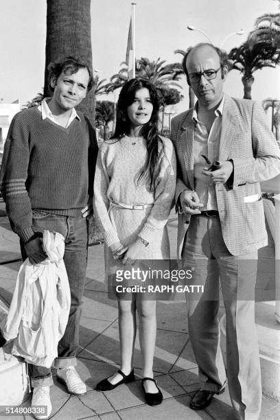 French actor Patrick Dewaere, actress Ariel Besse and film director Bertrand Blier pose on May 21, 1981 during the 34th Cannes Film Festival. They...